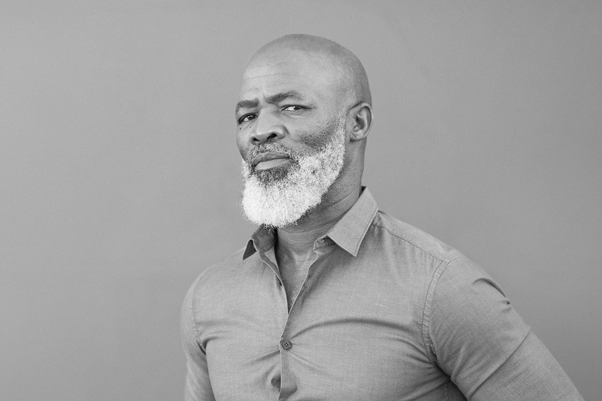 A Man Wearing A Suit And Tie